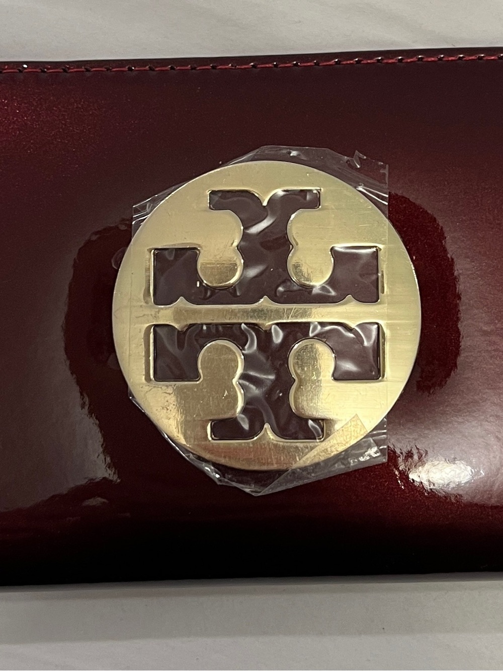 Tory Burch Burgundy Patent Clutch with Gold Logo Medallion